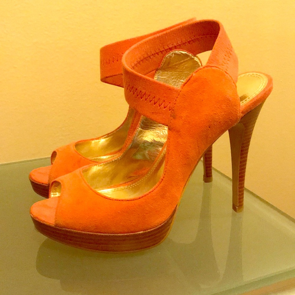 Coral colored suede heels.